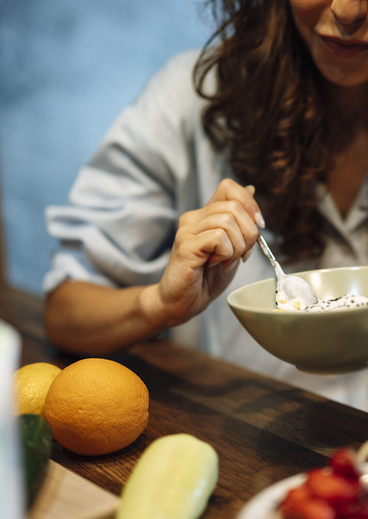 A woman enjoying a fresh, healthy meal